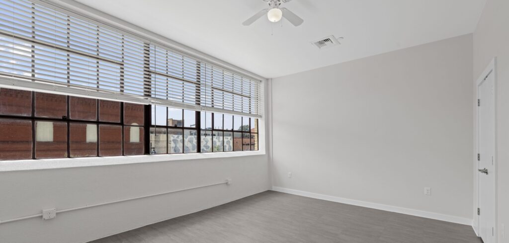Hawn West interior - large window view stretches wide across the entire length of the room.